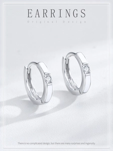 Close-up of S925 sterling silver hoop earrings with white enamel and sparkling zircon stone