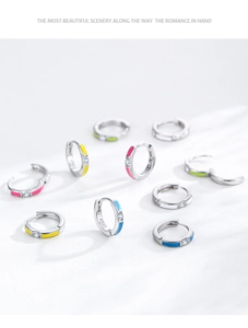 Close-up of colorful S925 sterling silver hoop earrings with enamel and zircon details
