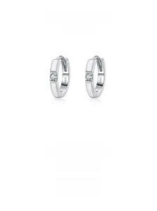 Macro shot of S925 sterling silver hoop earrings with white enamel and cubic zirconia