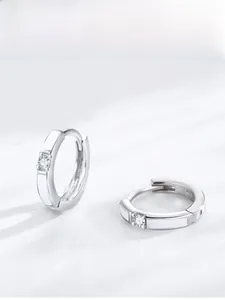 Detail of S925 sterling silver hoop earrings with white enamel and sparkling zircon stone