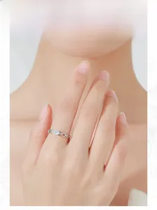 Close-up of S925 silver chain ring with pear-shaped zircon on finger model display