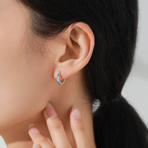S925 sterling silver huggie earrings with sky blue enamel and sparkling cubic zirconia