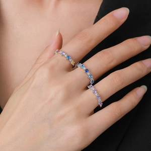 Set of three S925 silver rings with colorful heart-shaped cubic zirconia on hand