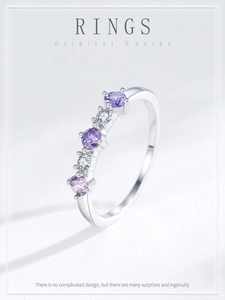 Macro detail of S925 silver ring featuring alternating purple and white cubic zirconia