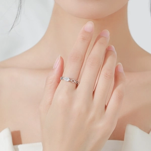 Elegant S925 silver ring featuring a pear-cut zircon and hollow curved chain design