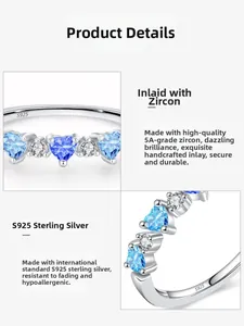 Macro shot of S925 sterling silver band showing S925 hallmark and blue heart zircon setting