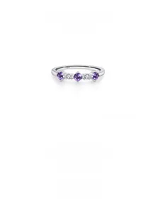 Detailed macro view of S925 sterling silver ring with purple cubic zirconia stones