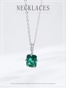Detail of 925 silver necklace with emerald cut zircon in a four-prong setting