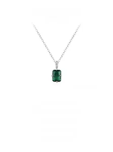 Macro shot of rectangular emerald-cut green stone and silver chain pendant detail