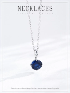 Macro shot of S925 silver necklace with round blue sapphire pendant and clear zircon