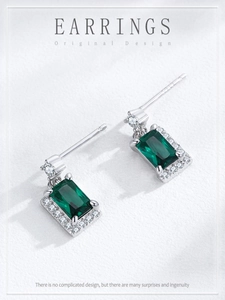 Macro detail of S925 sterling silver stamp on green zircon square stud earrings