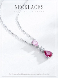 Detail of S925 silver necklace with vertical pink and red teardrop crystal pendants