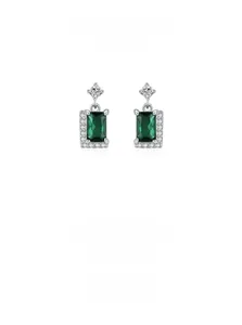 Macro shot of emerald-cut green zircon stud earrings with sparkling S925 silver accents
