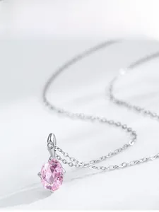 Detail of 925 silver necklace with pink oval zircon pendant and fine micro-pave hook