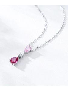 Macro shot of S925 silver necklace featuring a vertical teardrop tri-color gemstone pendant