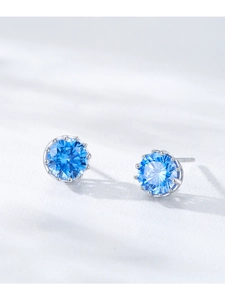 Detailed view of S925 sterling silver studs with round-cut sky blue cubic zirconia stones