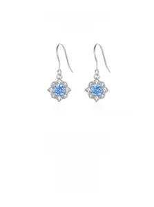 Macro shot of S925 sterling silver flower drop earrings with sky blue zircon and small diamonds