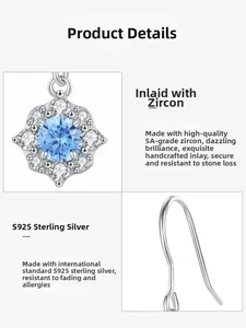 Detailed close-up of S925 sterling silver earrings with sea blue zircon flower pendant