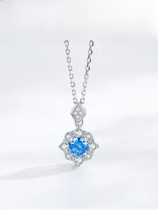 Detailed macro view of S925 sterling silver flower pendant with sea blue zircon and diamonds