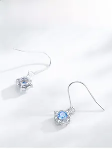 Detail shot of S925 silver flower earrings with light blue zircon and halo stones