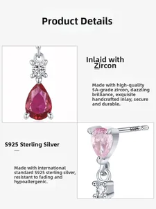 Detailed macro view of S925 sterling silver studs with pink teardrop stones and 5A cubic zirconia