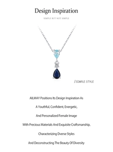 Detailed macro view of S925 silver necklace with blue teardrop zircon and round stone