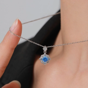 S925 sterling silver flower necklace featuring an aquamarine blue stone and zircon accents