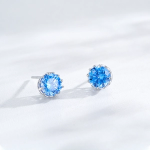 S925 sterling silver stud earrings featuring round cut blue zircon in 8-claw setting