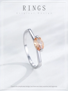 Macro shot of original design silver ring featuring an elegant champagne oval gemstone