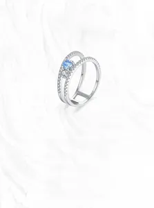 Macro detail of S925 sterling silver stamp on double layer ring with blue zircon
