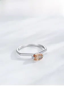 Detail view of S925 silver ring featuring marquise-cut champagne zircon and geometric band