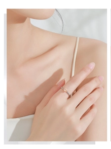 Elegant S925 silver ring with oval champagne zirconia on model hand in soft light