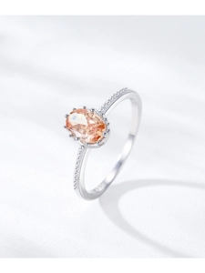 Close-up of S925 sterling silver ring featuring a champagne oval zircon with milgrain detail