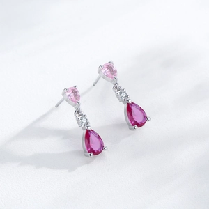 Elegant S925 sterling silver drop earrings with pink pear-shaped gemstones on white background