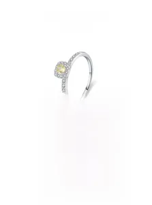 Macro view of S925 sterling silver ring with yellow gemstone and square halo crystals
