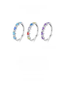 Close-up of S925 sterling silver rings with colorful heart-shaped zircon gemstones