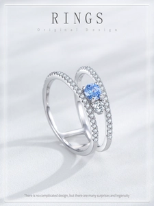 Detail of S925 silver double-layered ring with blue gemstone and white zircon stones
