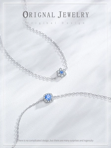 Macro detail of S925 silver bracelet with sky blue gemstones and floral design
