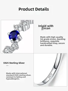 Macro shot of S925 sterling silver ring featuring a blue sapphire and zircon stone setting