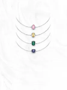 Macro detail of S925 sterling silver bracelets with colorful zircon stones in four shapes