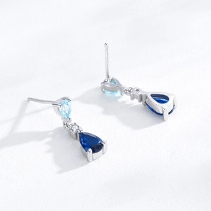 Elegant S925 sterling silver drop earrings featuring blue pear-shaped zircon gemstones