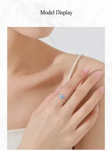 Close-up of S925 silver double-layered ring with sky blue gemstone worn by a model