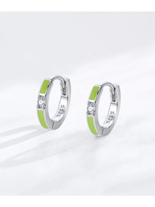 Macro detail of S925 sterling silver hoop earrings with green enamel and clear zircon