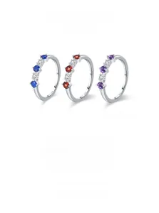 Detailed macro view of S925 sterling silver rings with colorful zircon stone settings