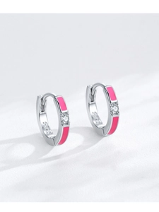 Macro shot of S925 silver hoop earrings with pink enamel and sparkling zircon detail