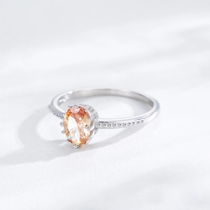 S925 sterling silver ring with oval champagne zircon and sparkling pavé accents