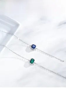Detail of S925 silver bracelets with emerald green and deep blue rectangular zircons