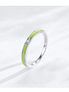 Close-up of S925 sterling silver ring with green enamel and a sparkling zircon stone