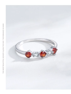 Macro shot of S925 silver ring featuring five alternating red and white zircons