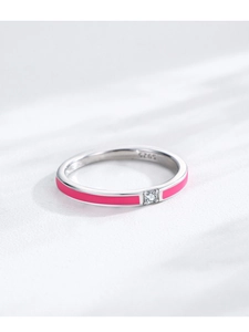 Macro view of S925 sterling silver ring with pink enamel and white zircon stone